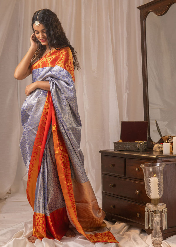 silver and orange bordered tissue silk saree