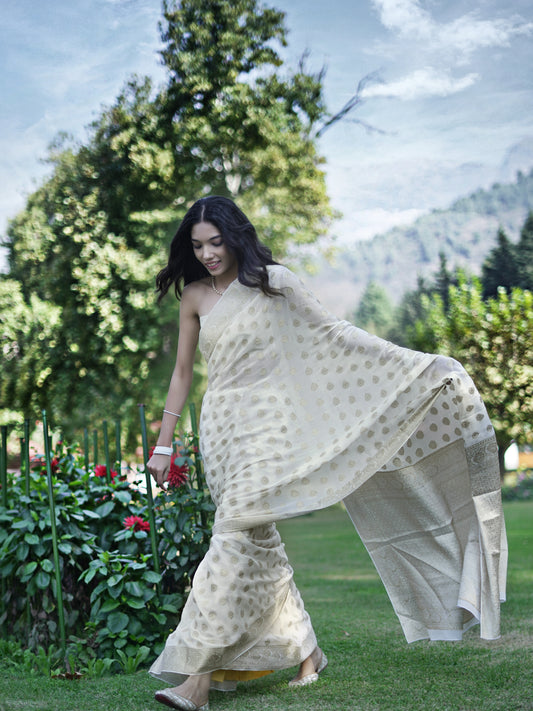 JYOTSANA - MILKY WHITE AND GOLD VISCOSE SAREE WITH OVERALL BUTTA